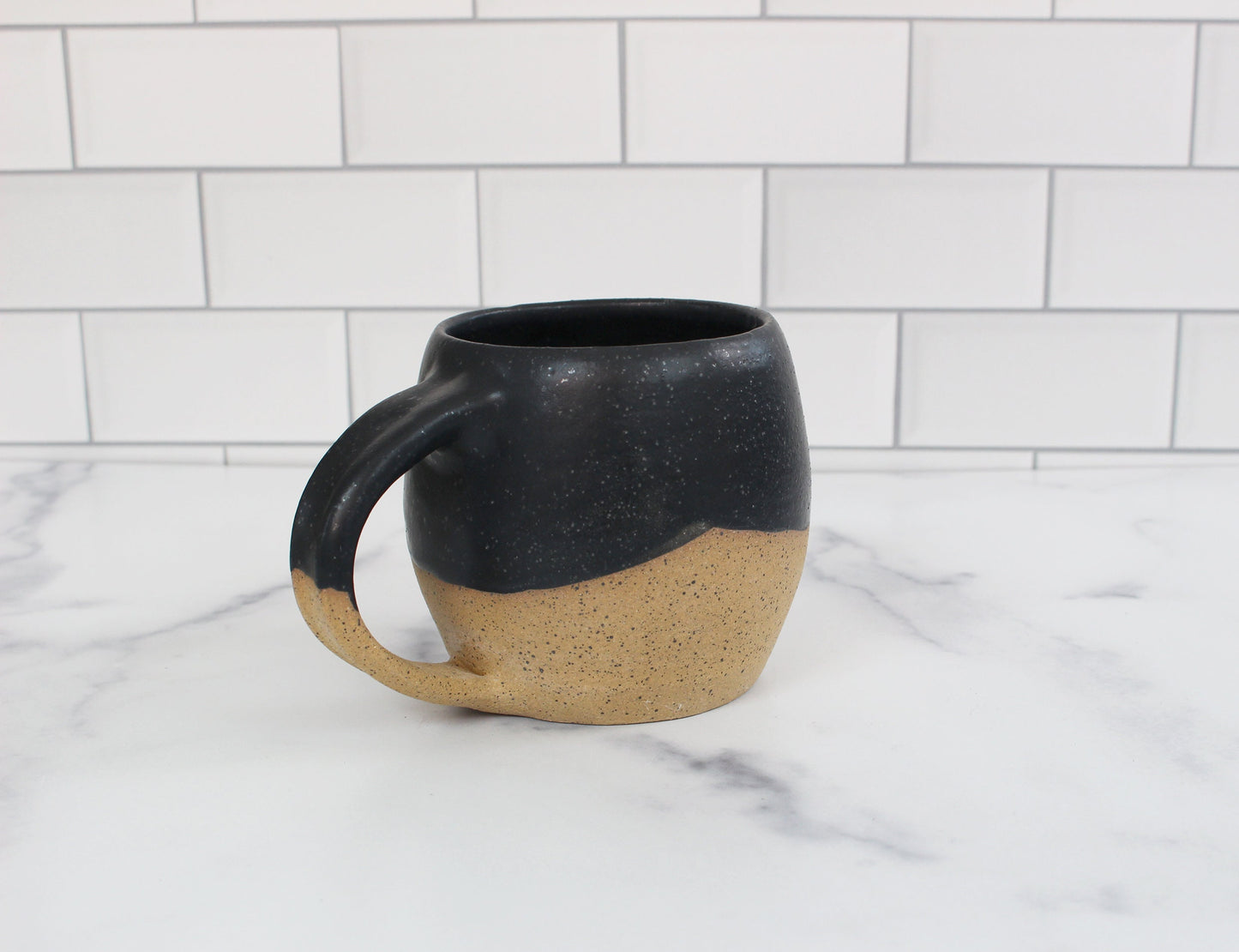 mountain themed mug on kitchen counter