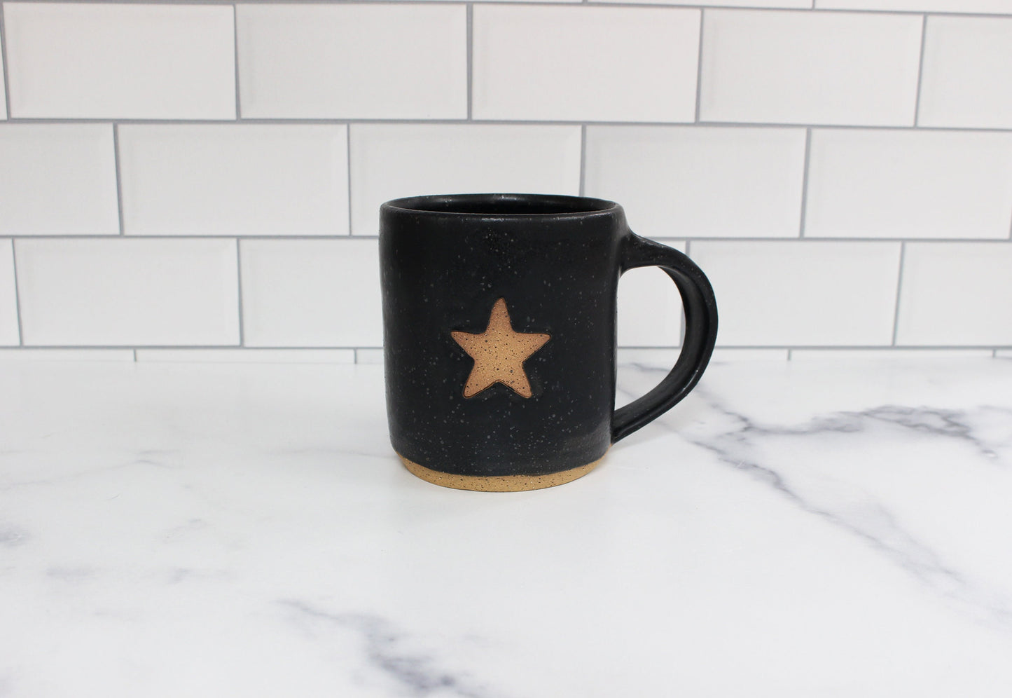black speckled handmade star mug