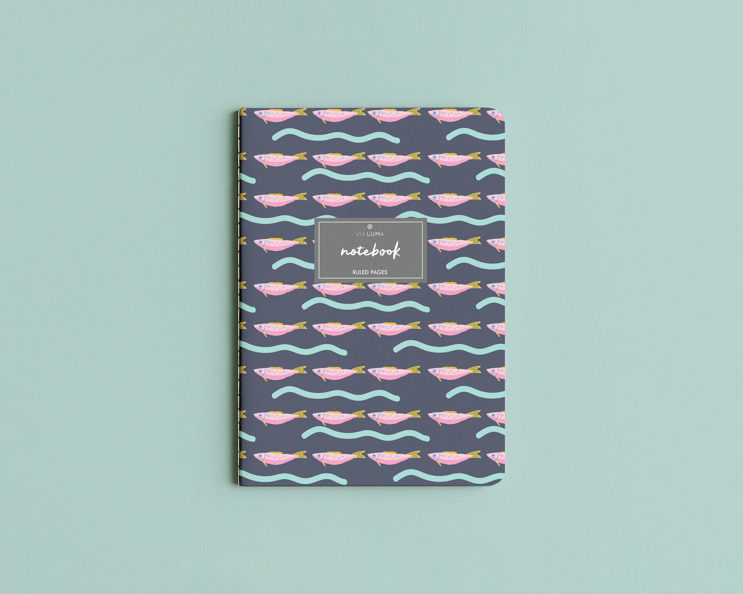 Notebook with fish pattern on a light blue background