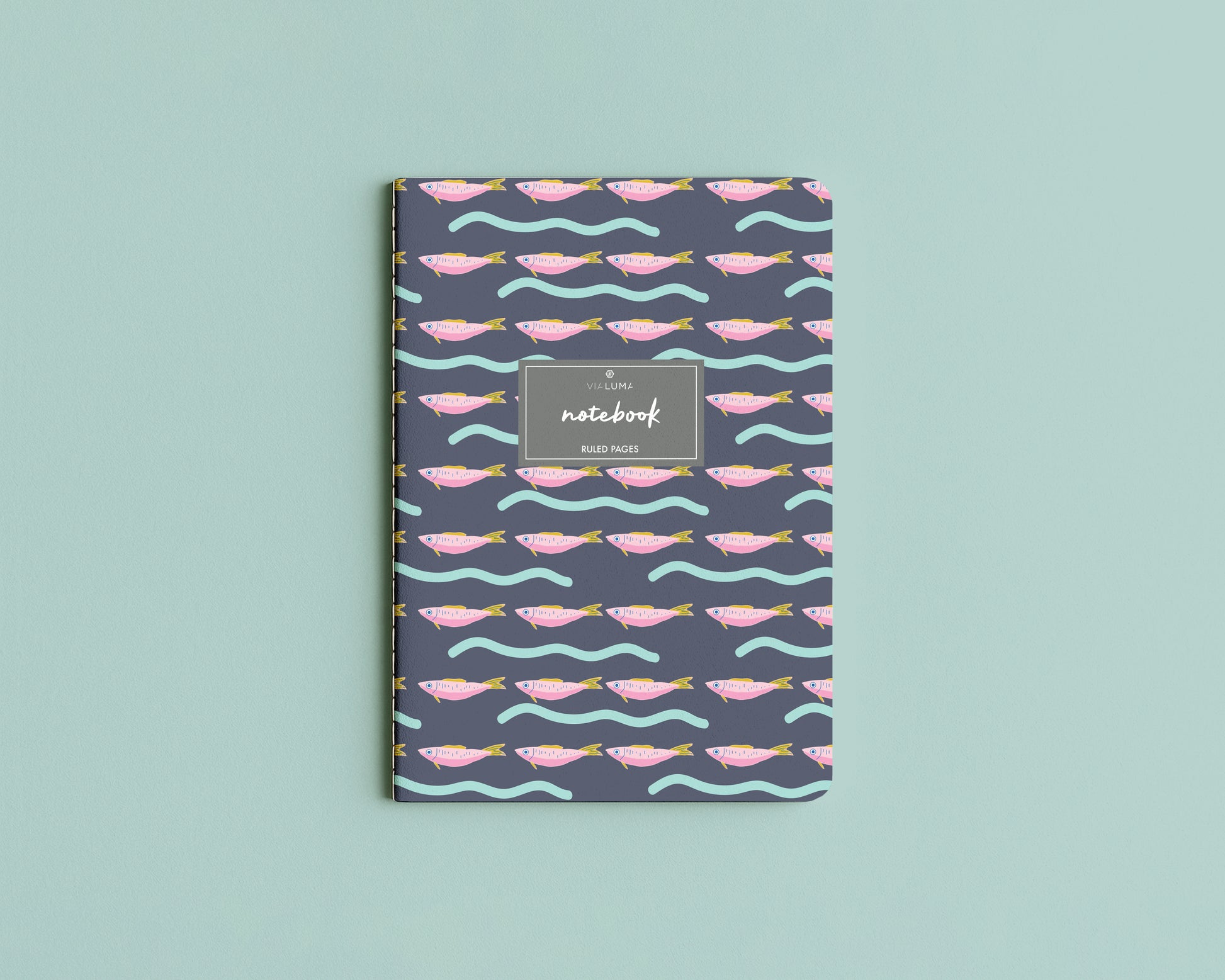 Notebook with fish pattern on a light blue background