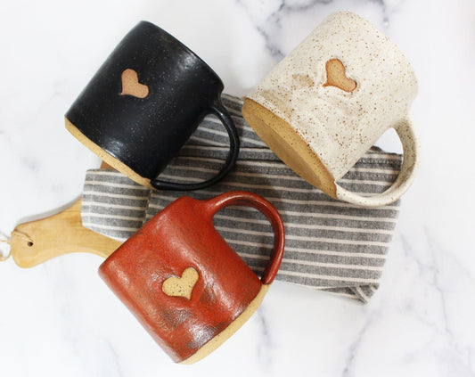 set of three coffee mugs with hearts